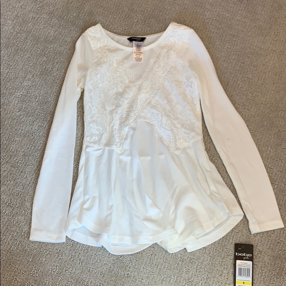 Girls Bebe peplum top.